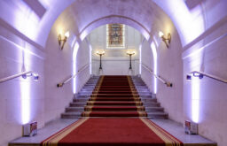 grand staircase, well lit, red and white furnishings