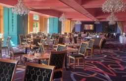 dining area, event room, bar at the back, chandelier