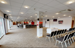 large conference space, view of the stadium ground, projector screen