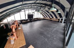 bar area, event space, plasma screen, table benches at the side