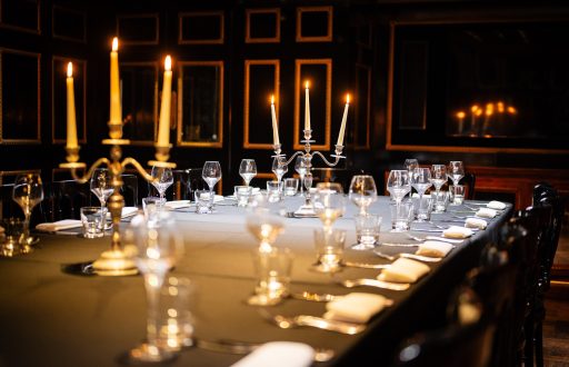 fine dining, intimate meeting room, candlelit tables, wine glasses