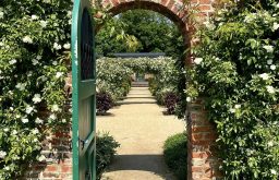 brickwall, green door entrance, beautiful garden event space