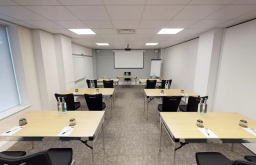 classroom, projector screen, glasses on the table