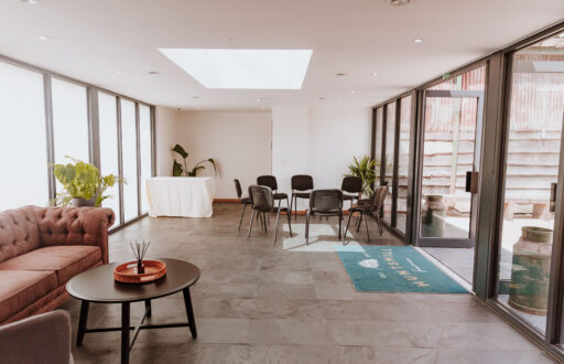 meeting space, natural lighting, a table to the side