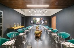 boardroom, wine & water glasses, art decor on the wall
