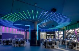conference room, colourful lighting, cabaret layout, large event space