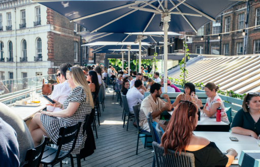 rooftop, summer party, drink reception, people sitting and talking
