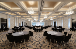 ballroom, cabaret layout, modern event space, lecturn and speakers chair