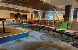 conference room, multi-coloured chairs, modern, stadium conference venue