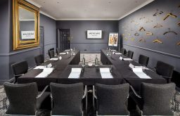 u shape meeting layout, comfotable chairs, meeting room, plasma screen, hangers on the wall, mirror