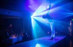 circus performer, blue light shining