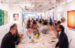 event in ssession, art on wallls, cabaret layout, people seated
