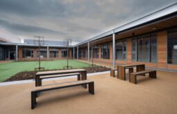 courtyard, outdoor event space, picnic benches and tables, cloudy skies