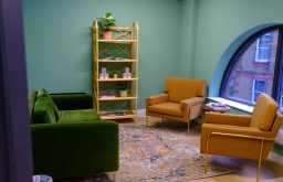 comfy chairs meeting space, shelves,