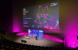 auditorium, large projector screen, speakers' chairs