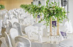 cabaret dinner set up, with candles , nicely decorated event space space, Banks Homes Riverside