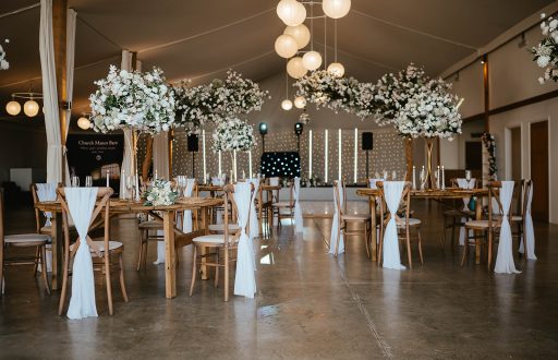 cabaret layout, event space, nicely decorated, flowers