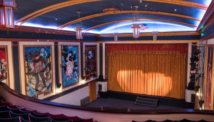 spotlight on stage curtains, auditorium, event venues