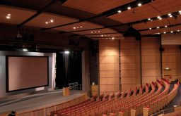 auditorium, projector screen, stage, stairs to the stage, lecturn