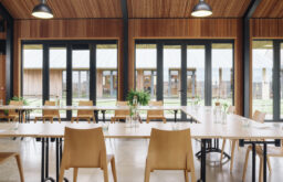 sustainable meeting room, u-shape layout, glass water bottles and glasses