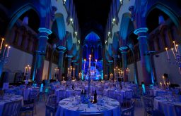 candle lit tables, blue lights, dinner set up, gala dinner, unique venue
