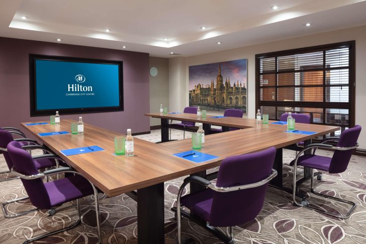 TV screen, u-shape table, comfortable chairs, venues
