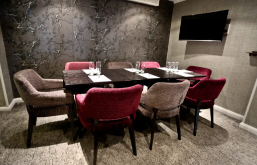 small meeting room, TV screen, comfortable chairs, boardroom layout