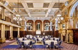 cabaret layout, large conference rooom, projector screen, modern and historic room, hotel