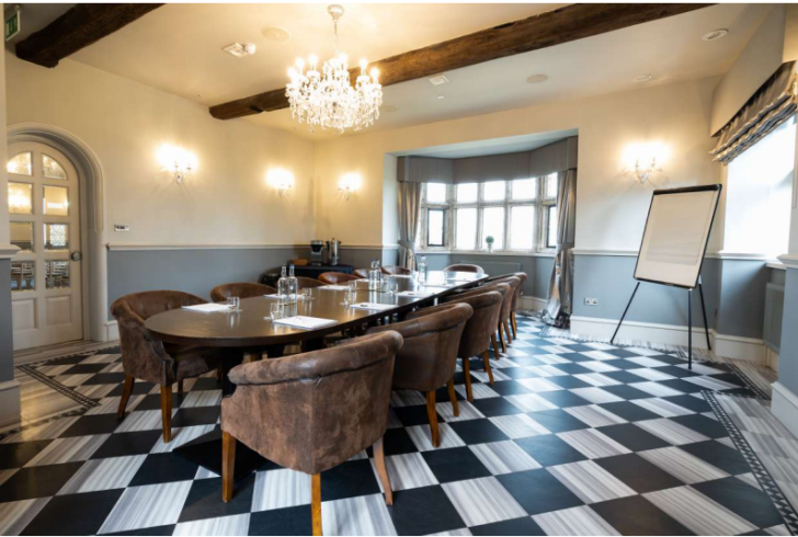 leather chairs, chandelier, flip chart