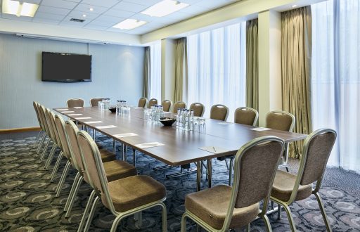 meeting room, boardroom, TV screen, natural daylight, water bottles