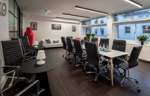 boardroom layout, meeting room, sofa, side tables, natural daylight