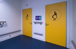 left hand side and right hand side , yellow doors, handrailsaccessible toilets,