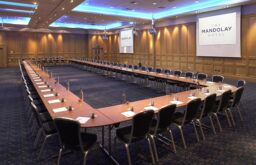 two projector screens. u-shape layout, large meeting room, modern, panelled walls, mandolay hotel