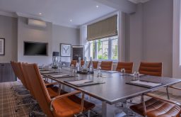meeting room, orange chairs, tv screen