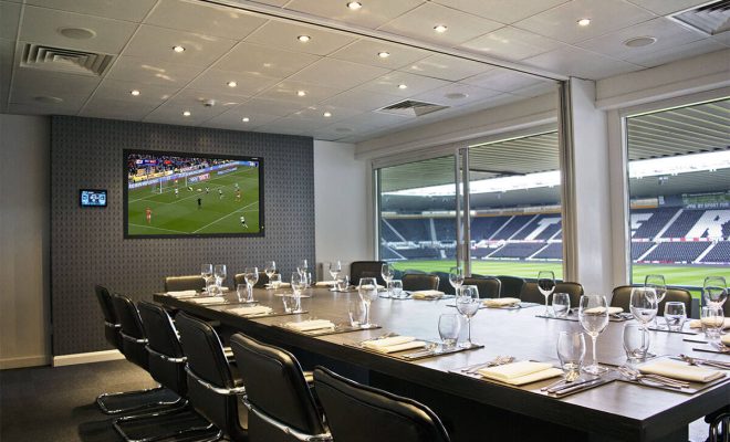 boardroom, chairs, screen, view of the stadium
