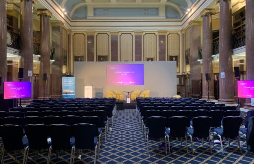 conference layout, conference speaker chairs, lecturn, TV screens