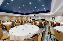 conference layout, flip chart, projector screen, notepads, modern
