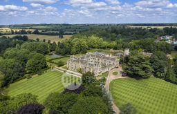 sky view of the rushton hall hotel, surrounded by greenery