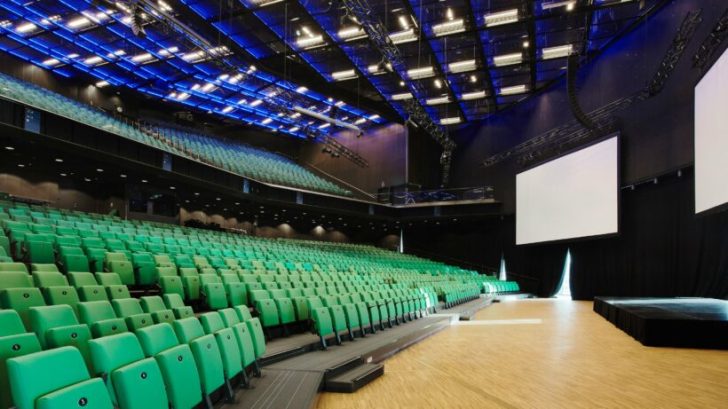 large auditorium space, projector screen