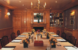 boardroom, wood pannelled wall, meeting room, nicely decorated, notepads