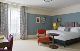 king hotel room, spacious, natural lighting