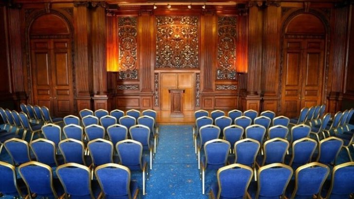 theatre layout, wooden panel, blue chairs