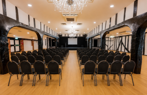 projector screen, theatre layout, lectern, conference room, chandelier, stage