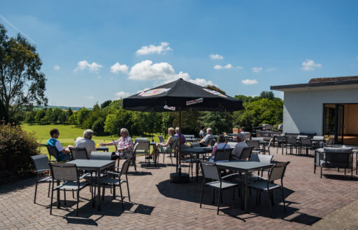 outdoor space, ideal for a summer party, outdoor tables and chairs, view of the golf course