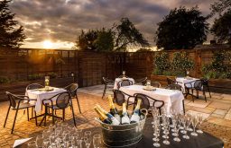 terrace, reception, wine in an ice bucket, wine flutes, outdoor tables and chairs