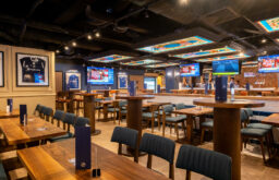 TV screen, poseur table, football club, event venue