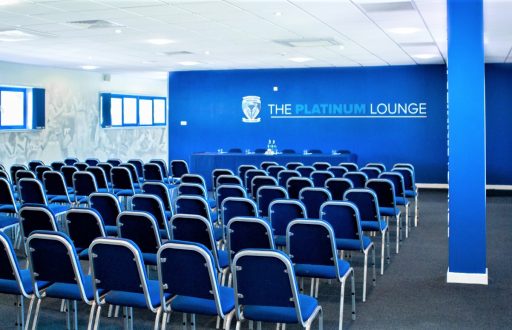 platinum lounge conference room, head table, blue chairs and a blue feature wall