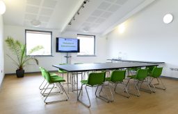 boardroom layout, green chairs