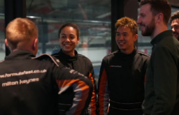 people preparing to go inside the go karts, group setting