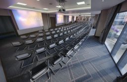 large event space, 3 projector screens, modern chairs